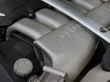 a close up of a car engine with the hood open