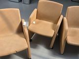 three chairs that are sitting in the middle of a room