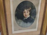 an old picture of a young boy in a blue dress