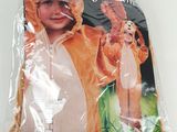 a small child wearing a lion costume in a plastic bag