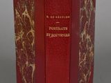 a red book with gold writing on it sitting on a table