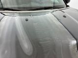 a close up of a car ' s windshield with rain on it