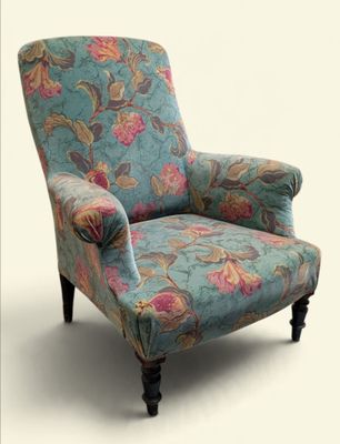 a blue chair with a floral pattern on it