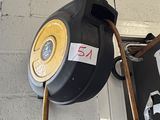 a picture of a black and yellow fire hydrant on a wall