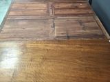 an image of a table with a wooden top in a room