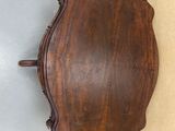 an image of a wooden table with a mirror on it