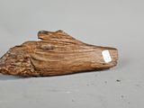 a piece of wood that has a tag on it