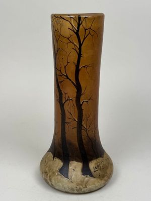a vase that has a picture of a tree on it