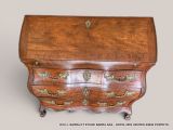 a small wooden desk with a drawer on top of it