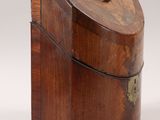 an old wooden box sitting on top of a white surface