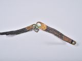 a small piece of leather with a metal hook attached to it