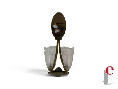 a spoon and two glasses sitting on a stand