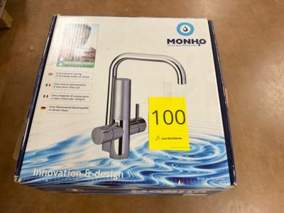 a box that has a water faucet inside of it