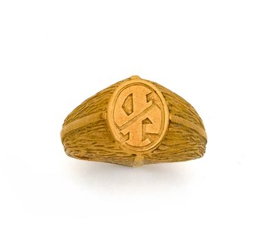 une image représentant une bague-sceau en or sur laquelle figure le symbole du dollar