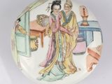 an image of a plate with a woman and a man on it