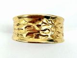 an image of a close up of a gold ring on a white surface