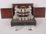 a wooden box with a set of glassware in it