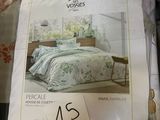 a lot of bedding items on display in a store