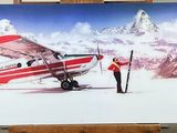 une photo d'un tableau représentant un avion posé sur un chevalet