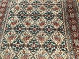 a close up of a rug on a wooden floor in a room