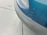 a blue car parked on the side of the road