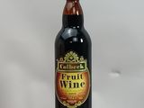 a bottle of fruit wine sitting on top of a box