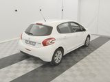 the white car is parked in the garage on the checkered floor