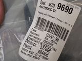 a person holding a plastic bag with a barcode on it