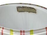 a white bowl with a red, yellow, and green stripe pattern on it