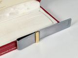 a red case with a knife in it on a white surface