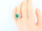 an image of a woman ' s hand with a ring on it