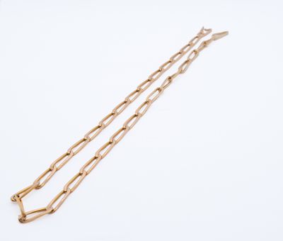 a pair of gold chain bracelets on a white background