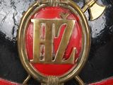 a close up of a fireman ' s helmet with a badge on it