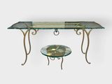 an image of a table with a glass top and metal legs