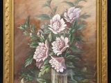 painting of pink flowers in a glass vase on a table