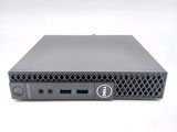 a close up of a dell desktop computer on a white surface