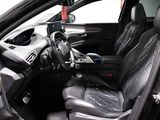 the interior of a car with the door open and the steering wheel down