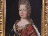 portrait of a lady in a red dress with a gold frame