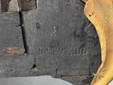 a close up of a piece of wood that has a handle on it