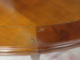 a close up of a wooden table with holes in it