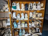 many different types of sewing machines on the shelves