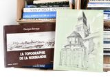 a lot of books that are sitting on a shelf