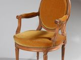 an image of a wooden chair with a yellow upholstered seat