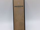 a bottle of lagerfield perfume sitting on a white surface