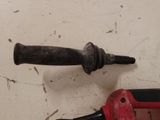 a drill and a hammer on a table