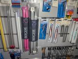 many pens and pencils on display in a store