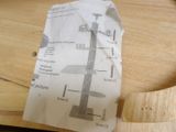 a piece of paper that has been cut up on a cutting board