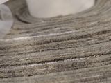 a roll of fabric on a table with a roll of tape