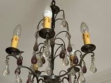 a chandelier hanging from the ceiling in a room