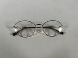 an image of a pair of glasses sitting on a table